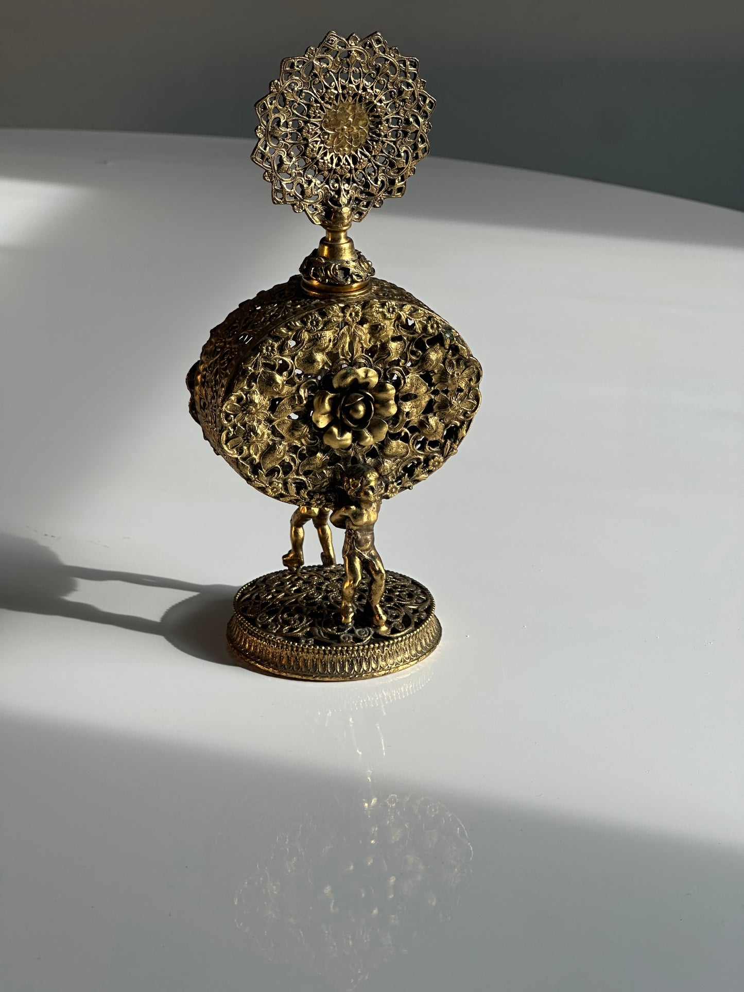 Vintage Filigree Perfume Bottle with Cherub Figures