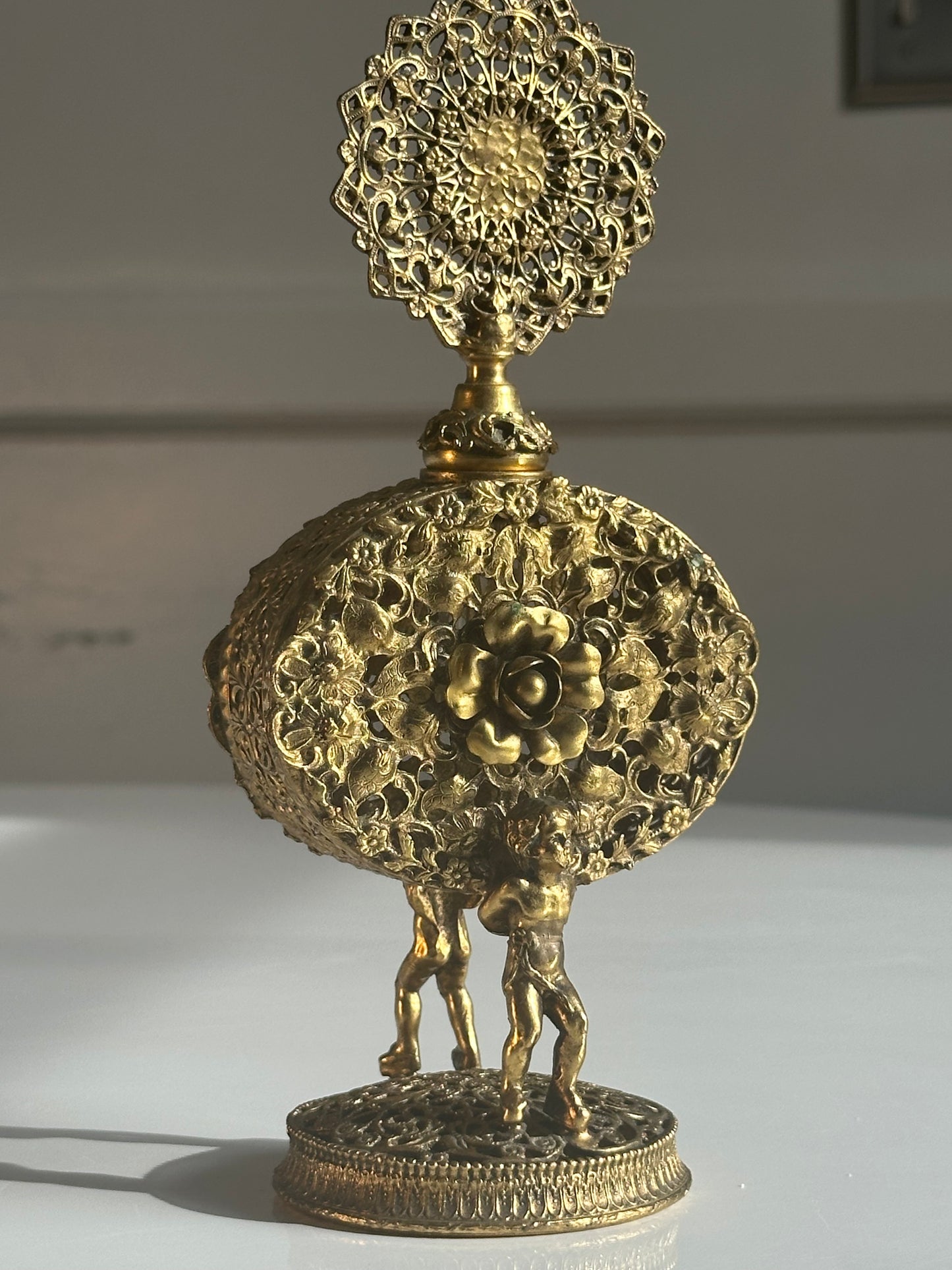 Vintage Filigree Perfume Bottle with Cherub Figures